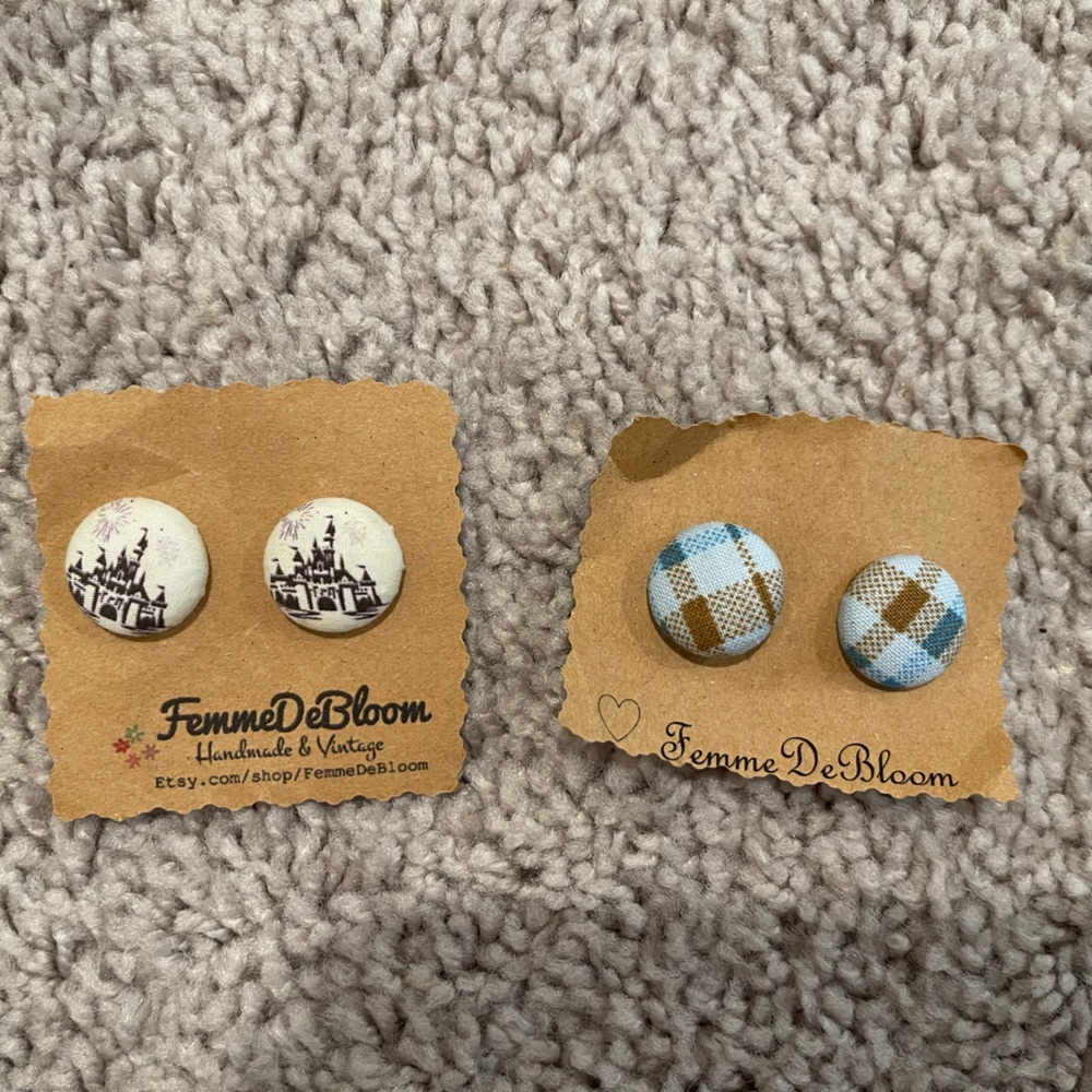 Two pair of stud earrings. Disneyland WDW Castle earrings and plaid earrings.